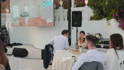 Guests are sitting at the table on beautiful wedding on seaside Stock Footage 201417838