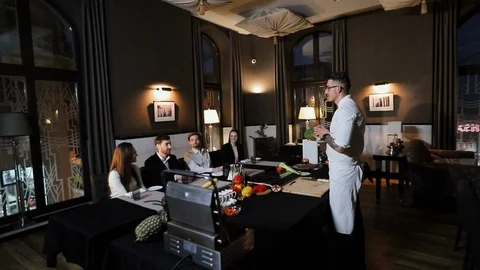 Guests At Chef's Cooking Class At Restaurant. Enthusiastically Listening. Stock Footage 122593037