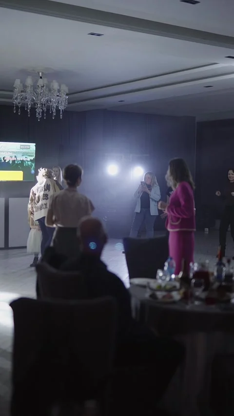 Guests dance and sing at the Ferienpark Hotel. Stock Footage 331656325
