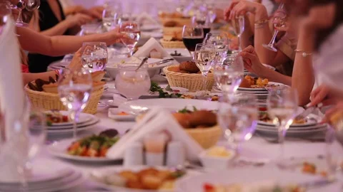Guests enjoy sitting at table and clink glasses with wine Stock Footage 111632523