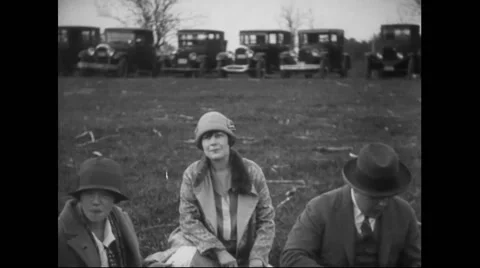 Guests having barbeque in lawn at General Billy Mitchell's barbeque farewell Stock Footage