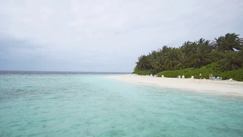 Guests on Luxury Resort's Private Beach in the Maldives Stock Footage