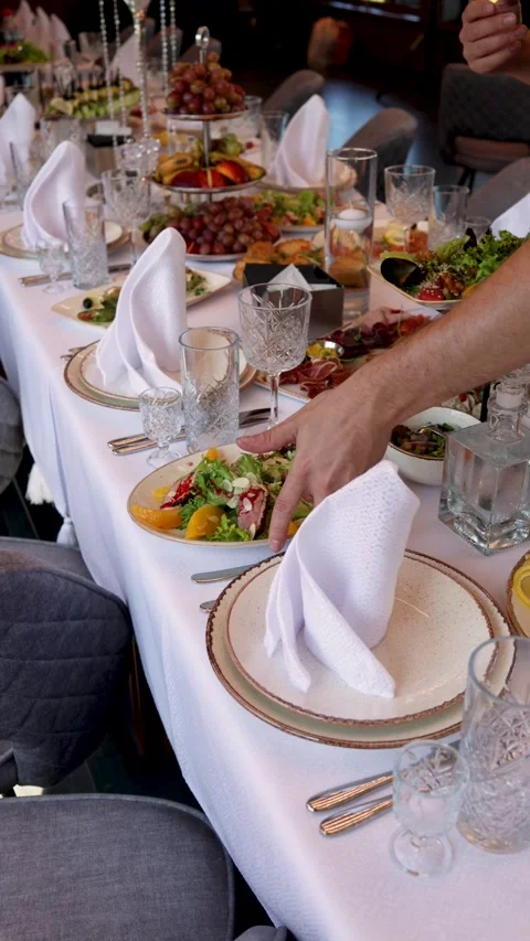 Guests seated at wedding banquet table with food Stock Footage 330081795