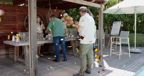 Guests serving at backyard event buffet after server placing items, gold Stock Footage 322220167