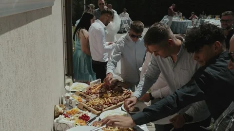 Guests Serving Themselves at Wedding Buffet Reception Stock Footage 342220903