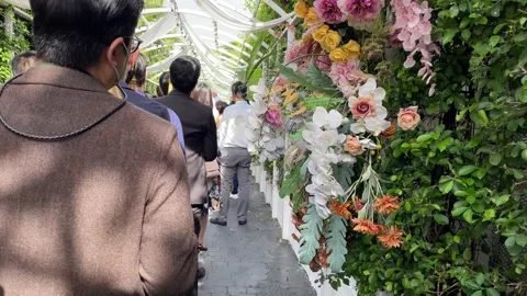 Guests standing at Thai tradition wedding ceremony event. Decorative outdoor Stock Footage 209535599
