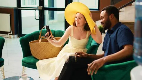 Guests using videocall meeting Foto stock