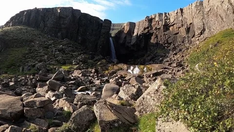 Gufufoss waterfall with dramatic rocky cliffs in East Iceland Stock Footage 333915494