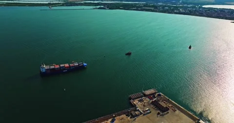 Guide Boat Turning Around In Front Of Large Freight Vessel Ship Arriving In Stock-Footage 300506754