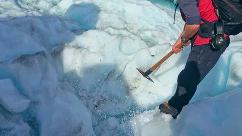 Guide to break the glaciers, Fox Glacier, New Zealand Stock Footage 79429159