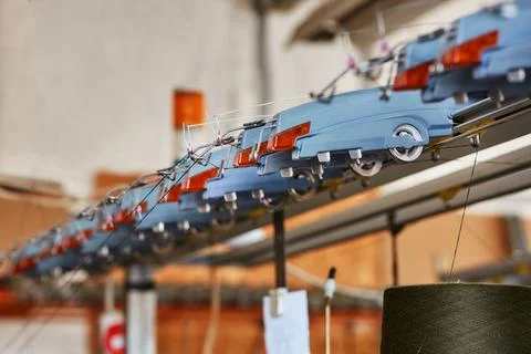 Guide elements of a large industrial knitting machine Stock Photos