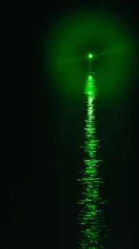 Guide light in a seaport at night Stock Photos