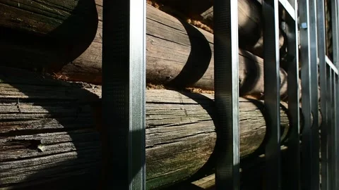 Guide metal strips on an old log wall, close-up, preparation for facing the hous Stock Footage 148010982