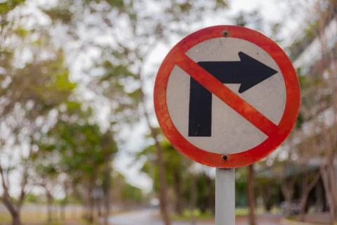 Guide post,don't turn right.sign on pole in the park Stock Photos