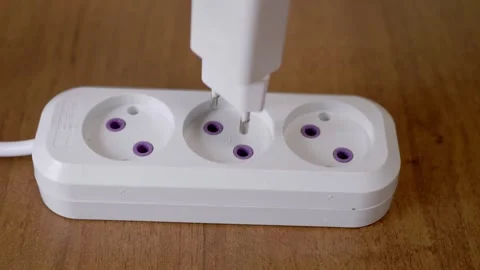 This guide shows how to use a power strip safely and effectively for electronics Stock Footage 314226389