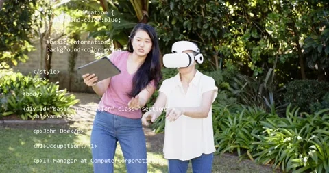 Guide tapping tablet and helping senior wearing VR headset, testing gesture Stock Footage 322703304