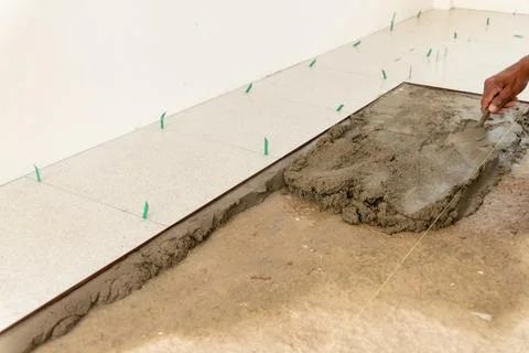 Guide to tile installation close-up process for indoor home improvement at .. Stock Photos