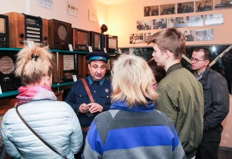 Guide to the visitors. Stock Photos