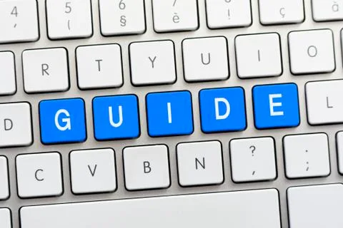 GUIDE writing on white keyboard Stock Photos