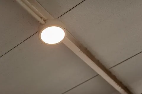 Guided installation process for modern indoor lighting in home improvement .. Stock Photos