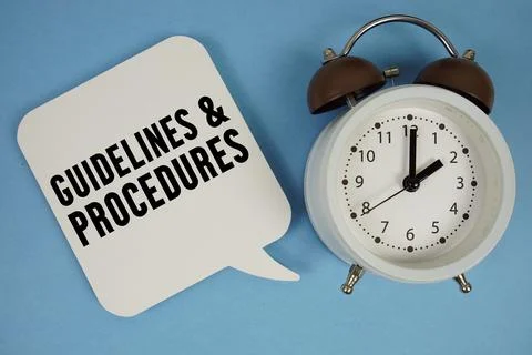 Guidelines And Procedures text with alarm clock on blue background Stock Photos