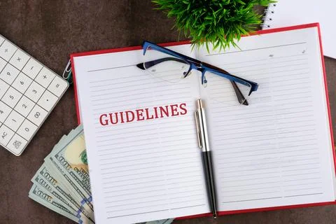 Guidelines concept. Guidelines word written on the open page of the business  Stock Photos