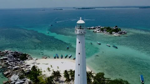 Guiding Light from Above: Aerial Spectacle of the Island Lighthouse Stock Footage 248943237