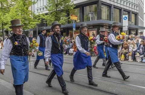 Guild Members and Spectators Exchanging Flowers During Sechseluten Spring P.. Photos