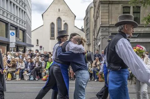 Guild Members and Spectators Exchanging Flowers During Sechseluten Spring P.. Photos