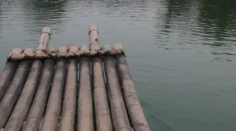 Guilin China floating down flowing river water on bamboo raft  beautiful Stock Footage 22331425