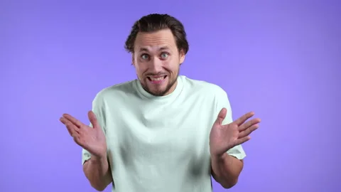Guilty confused man making oops, im sorry expression. Guy is ashamed and he Stock Footage 150187539