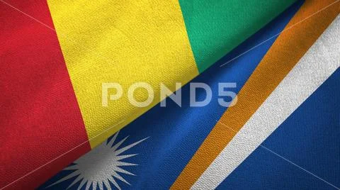 Guinea and Marshall Islands two flags textile cloth, fabric texture Stock Photos