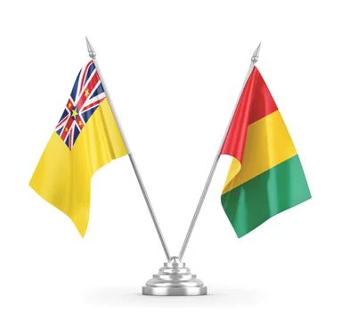 Guinea and Niue table flags isolated on white 3D rendering Stock Illustration