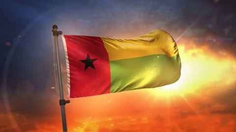 Guinea-Bissau Flag Backlit At Beautiful Sunrise Loop Slow Motion 4K Stock Footage 76415696