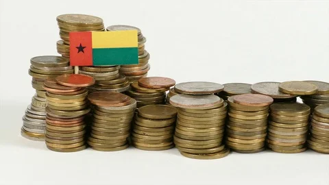 Guinea Bissau flag waving with stack of money coins Stock Footage 71935556