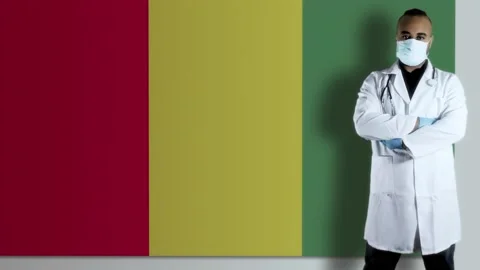 Guinea  doctor with flag Stock-Footage 153365430