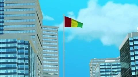 Guinea Flag 3D Render Animation with Urban Architecture and Clear Blue Sky Video stock 333049315