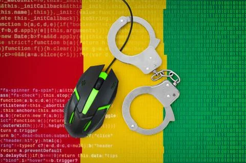 Guinea flag  and handcuffed computer mouse. Combating computer crime, hackers Stock-Fotos