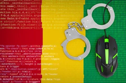 Guinea flag  and handcuffed computer mouse. Combating computer crime, hackers Stock-Fotos