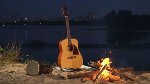 Guitar and drum by the fire Stock Footage 82298516