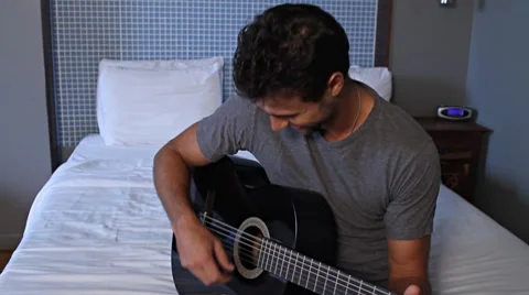 Guitar and Handsome young man playing 스톡 동영상 7730853