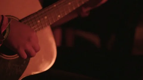 Guitar Being Played Reflecting Campfire Stock Footage 70405656