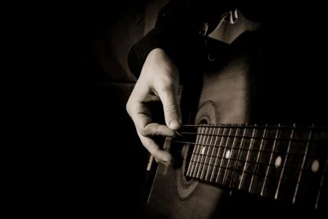 Guitar at black background Stock Photos