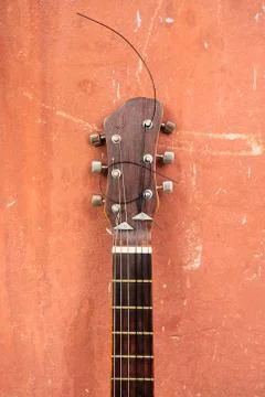 Guitar on a brown background Stock Photos