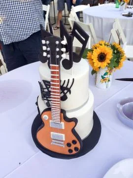 Guitar cake on table Stock Photos