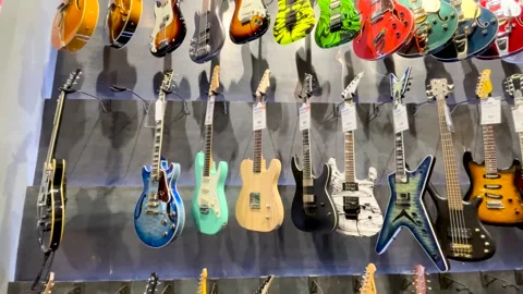 Guitar Center retail store interior wall of electric guitars middle row Stock Footage 170341544