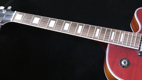 Guitar fretboard strings tracking shot background Stock Footage 74466464