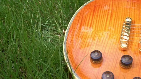 Guitar on the grass Video stock 107991267