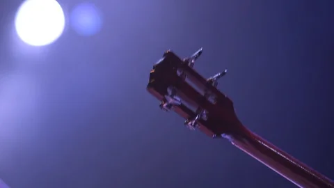 Guitar Head Over Blurred Backround Video stock 128540026