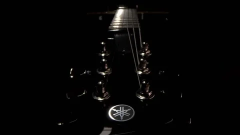 Guitar headstock in black space Stock Footage